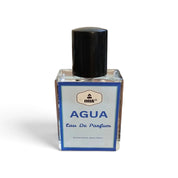 A small rectangular glass perfume bottle labeled 'misk AGUA Eau De Parfum' with a black cap, set against a plain white background.