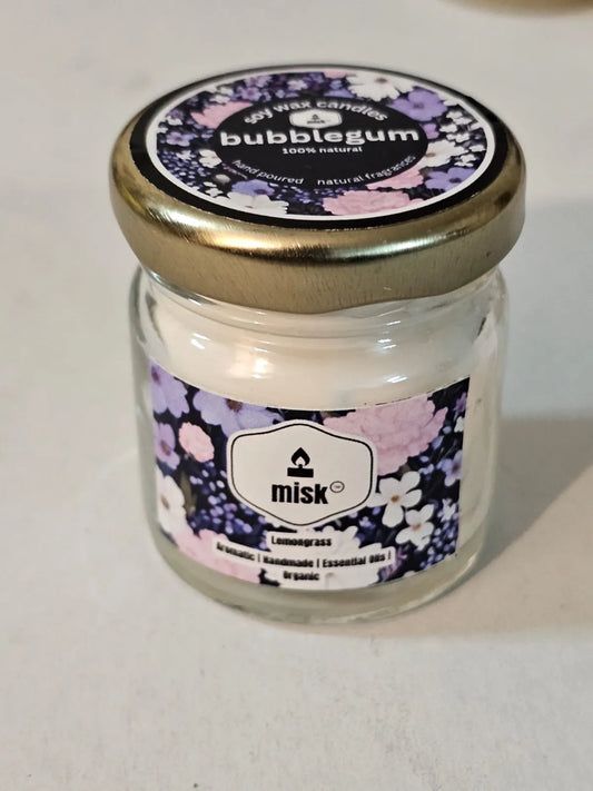 Jar of 'bubblegum' scented candle with decorative label on a white background