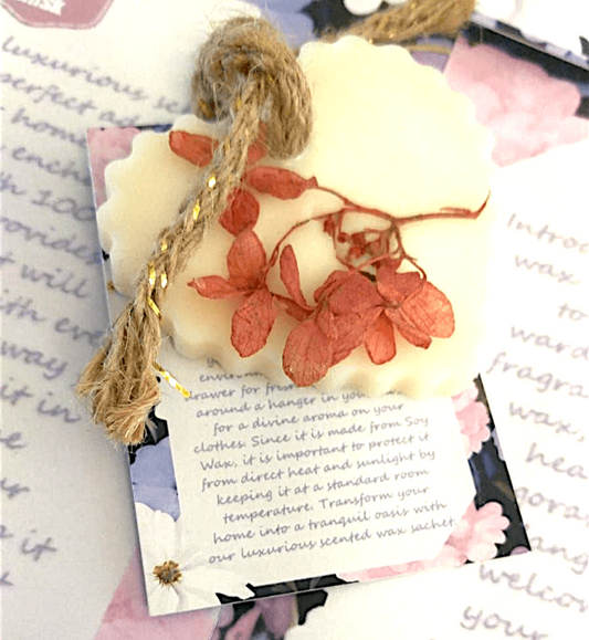 Decorative wax sachet with floral design and a card with text on a floral background