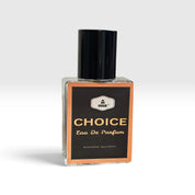 A rectangular glass bottle of Misk Choice Eau De Parfum with a black cap and a black label featuring gold lettering and a peach border, set against a light gray background.