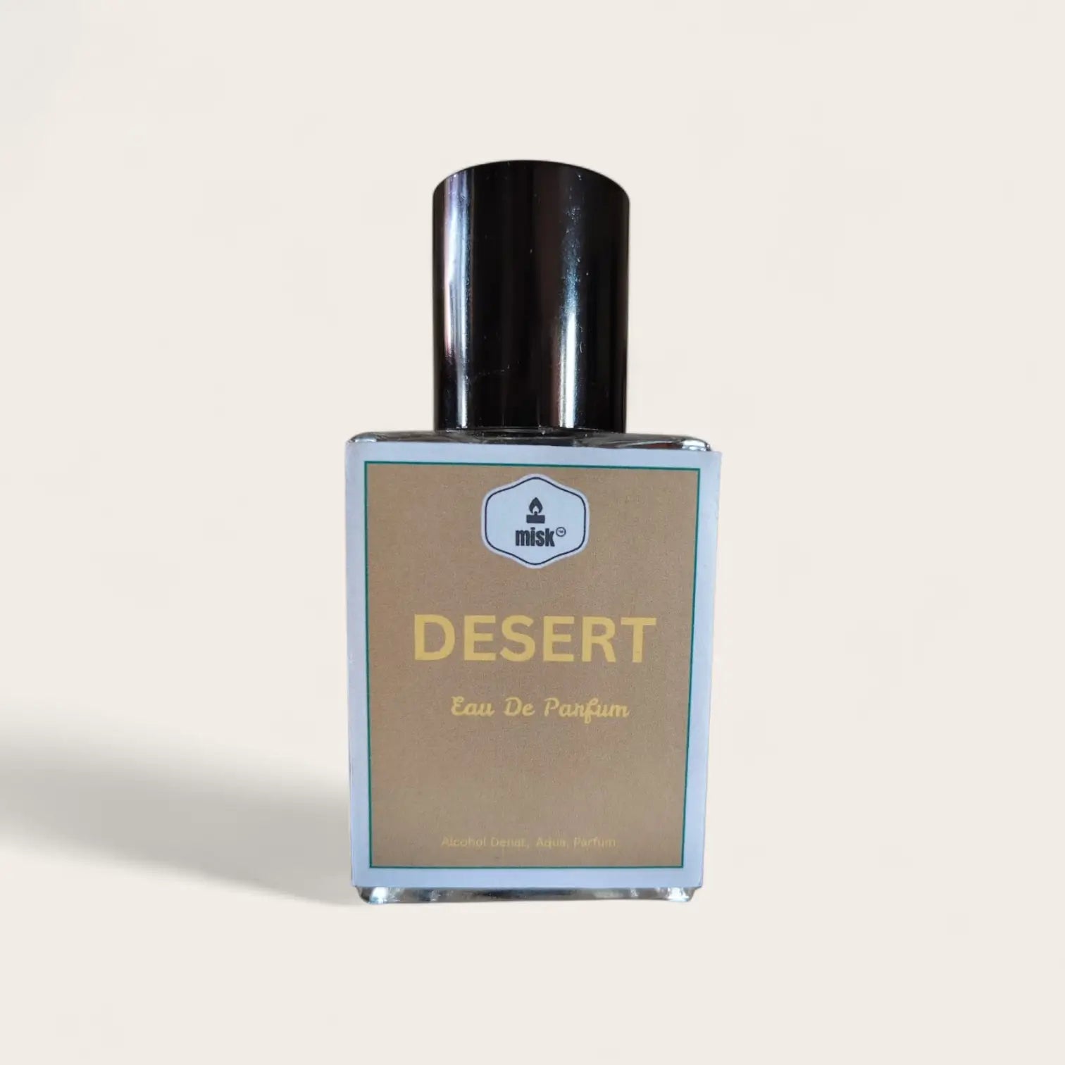 Studio image of a perfume bottle labeled 'Desert' by Misk on a light gray background