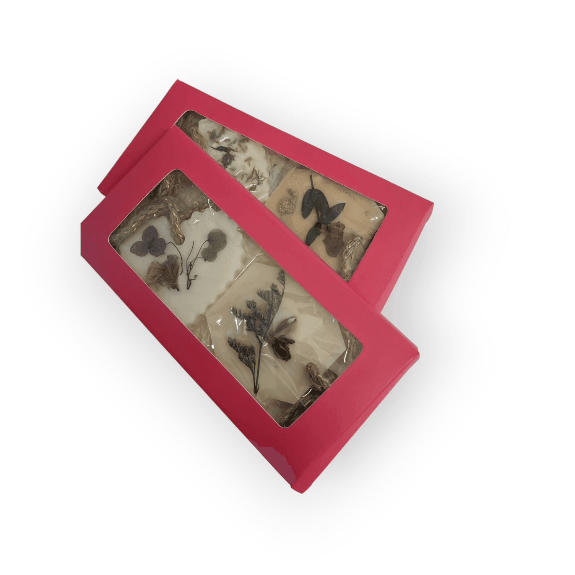Red box with clear window containing wax sachets decorated with pressed flowers