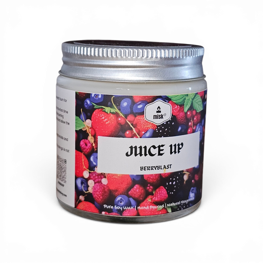 Juice Up soy wax candle with berry design and 'misk' branding on a white background