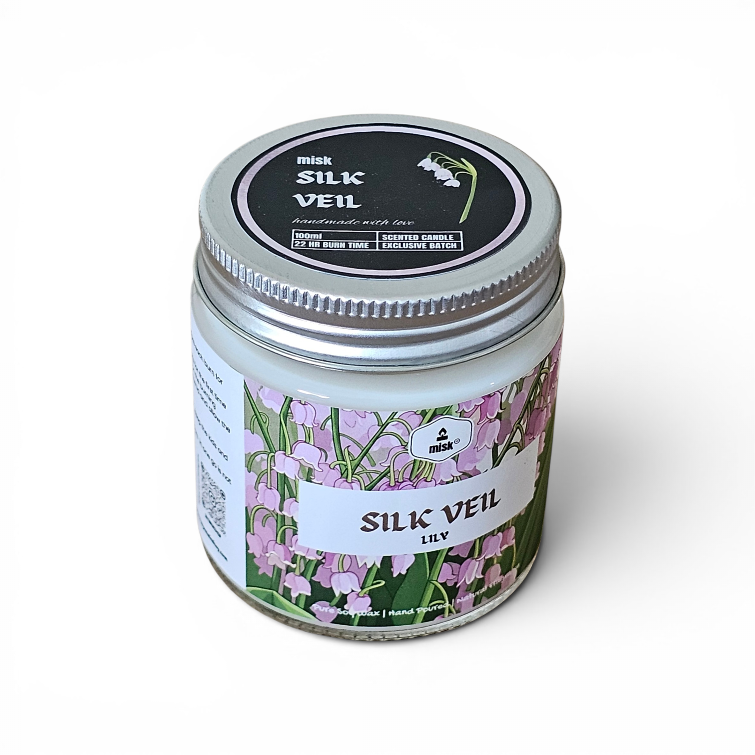 Candle jar labeled 'Silk Veil Lily' by misk on a white background