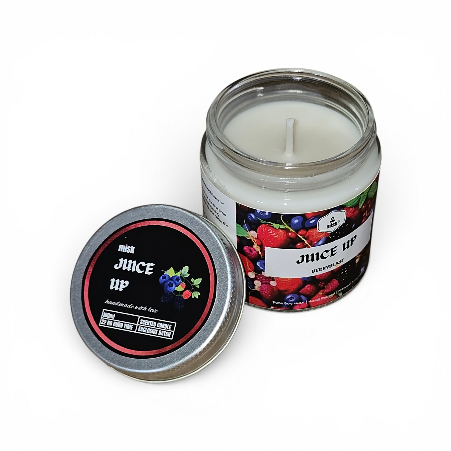 Candle in a jar labeled 'Juice Up' with a colorful label on a white background