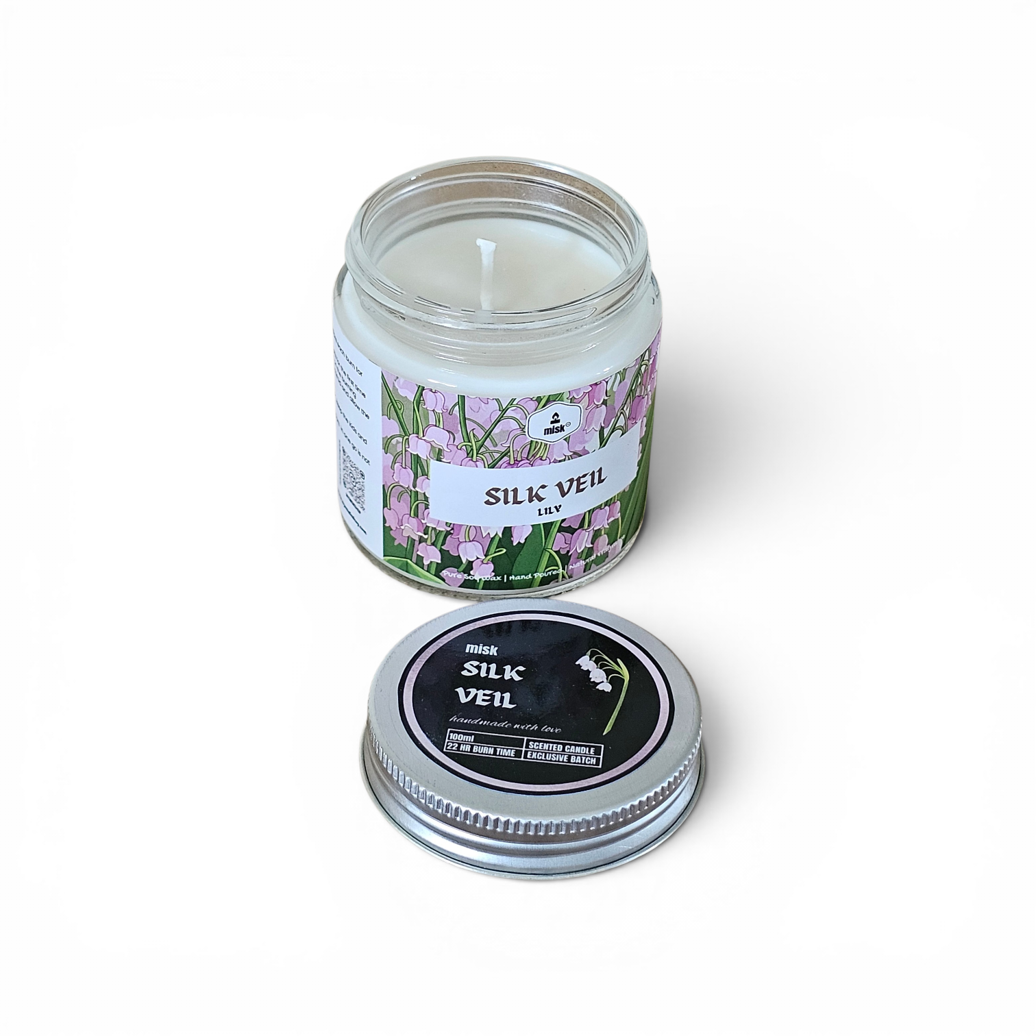 Silk Veil Candle in a glass jar with a decorative label on a white background
