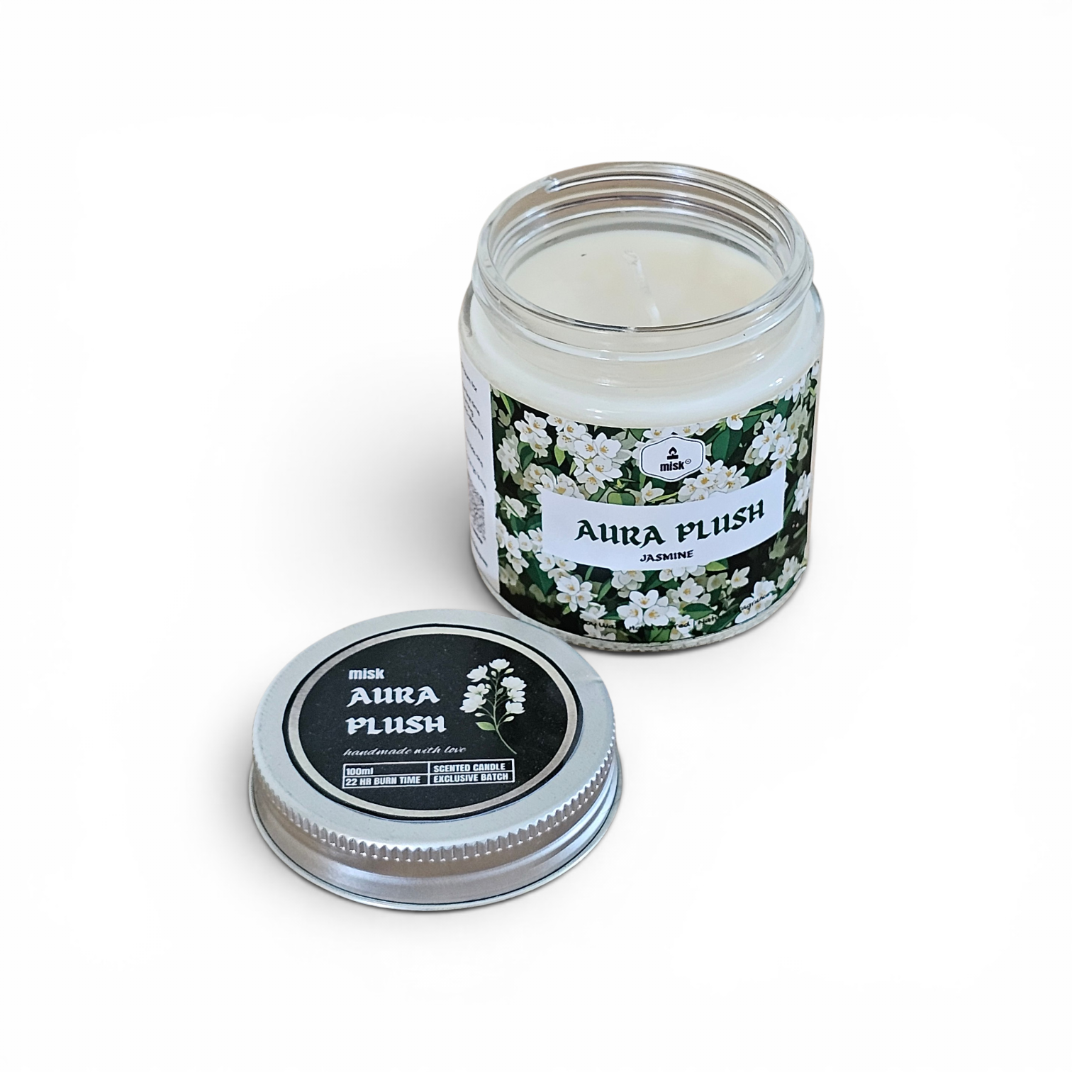 Candle jar with floral label and matching lid on a white background