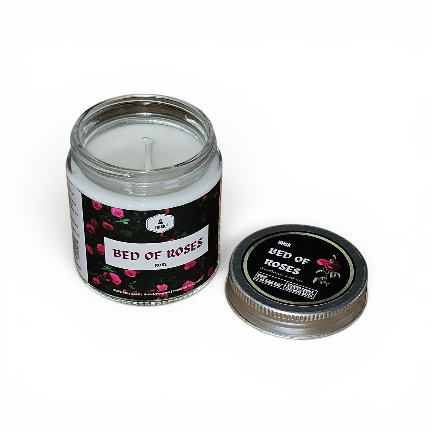 Candle Bed of Roses in a glass jar with a floral label on a white background